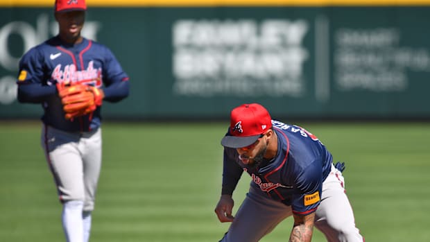 Braves infielder Leury Garcia (#63) scoops up a ground ball during a fielding drill Tuesday, Feb. 20, 2024 at CoolToday Park in North Port, Florida.  